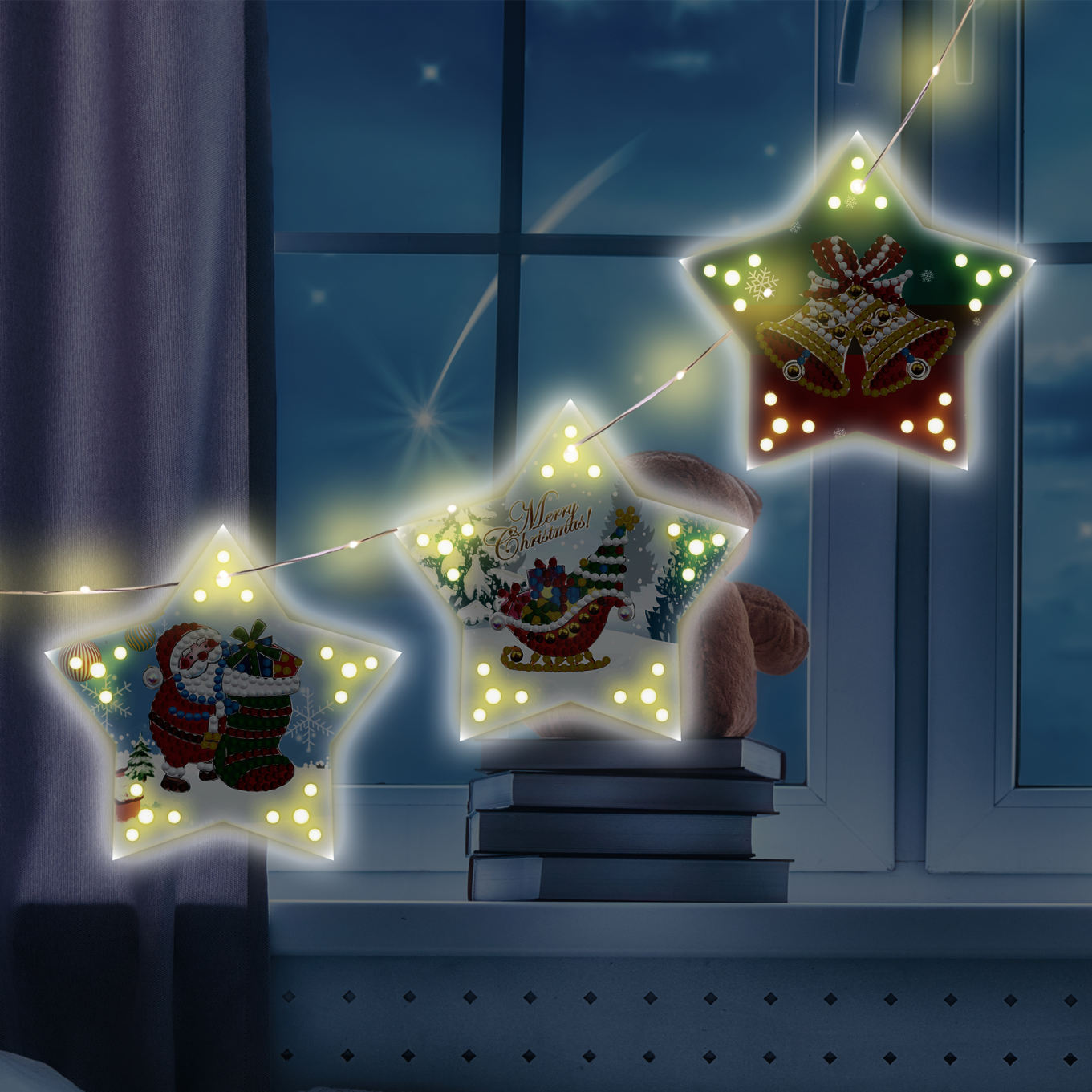 Julestjerner med lys – julemand, juleklokke og kane